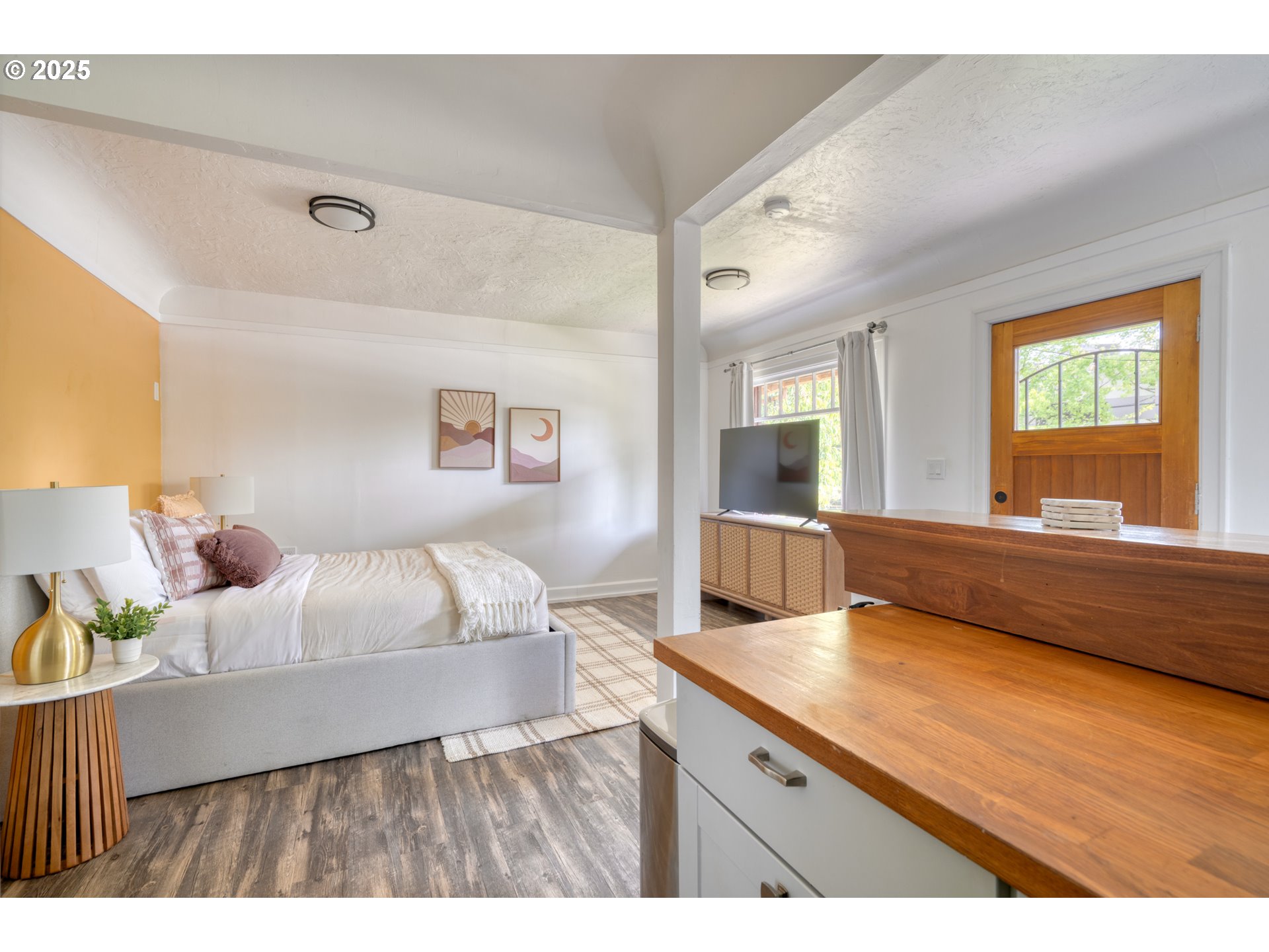9647 Southwest Capitol Highway Portland, OR 97219 - Photo 32 of 33 a living room with a couch and a large window