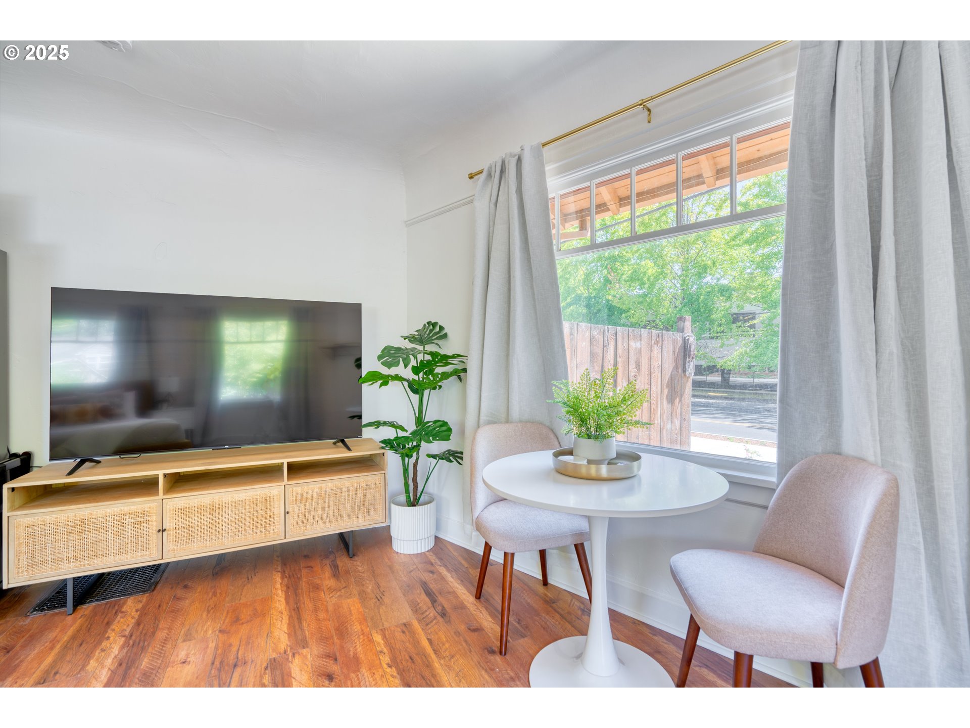 9647 Southwest Capitol Highway Portland, OR 97219 - Photo 8 of 33 a living room with furniture and a flat screen tv