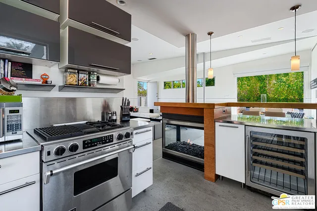 a kitchen that has a stove and a refrigerator