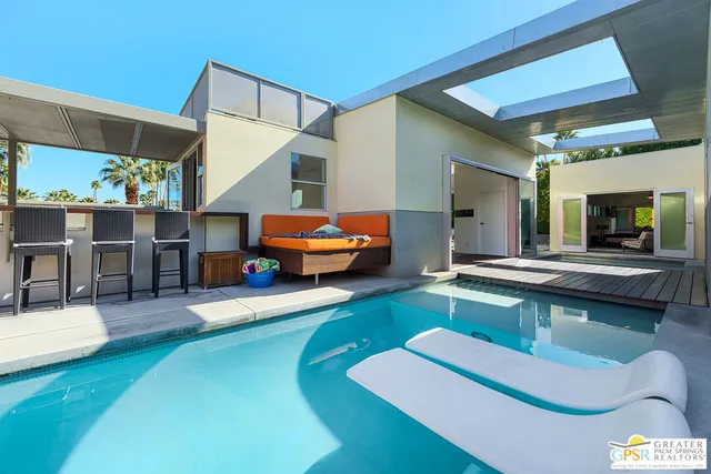 a room with wooden floor and furniture