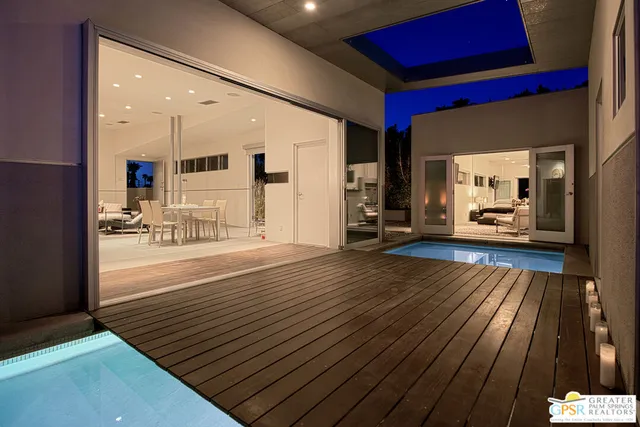 a spacious bedroom with furniture and a couch