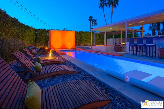 a view of swimming pool with a backyard