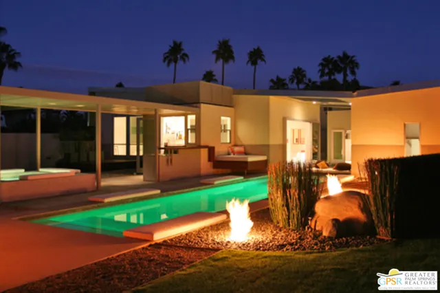 a room with pool table and windows