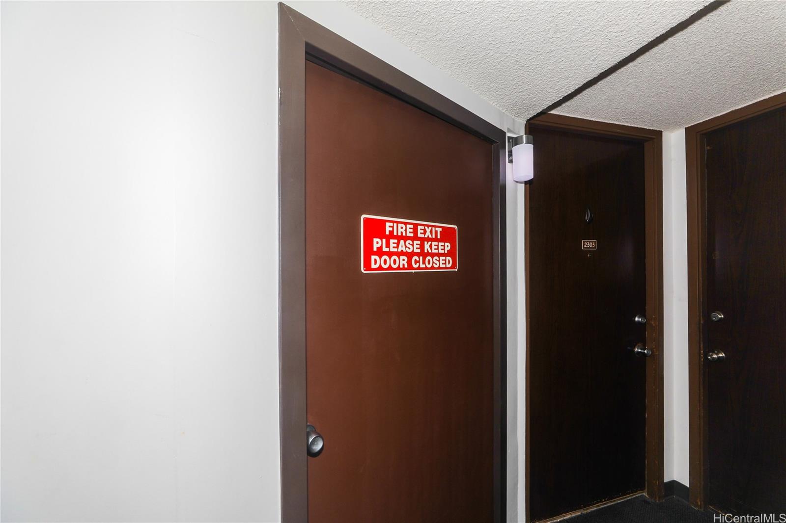 2525 Date Street, Unit 2303 Honolulu, HI 96826 - Photo 13 of 25 a sign that is on the wall