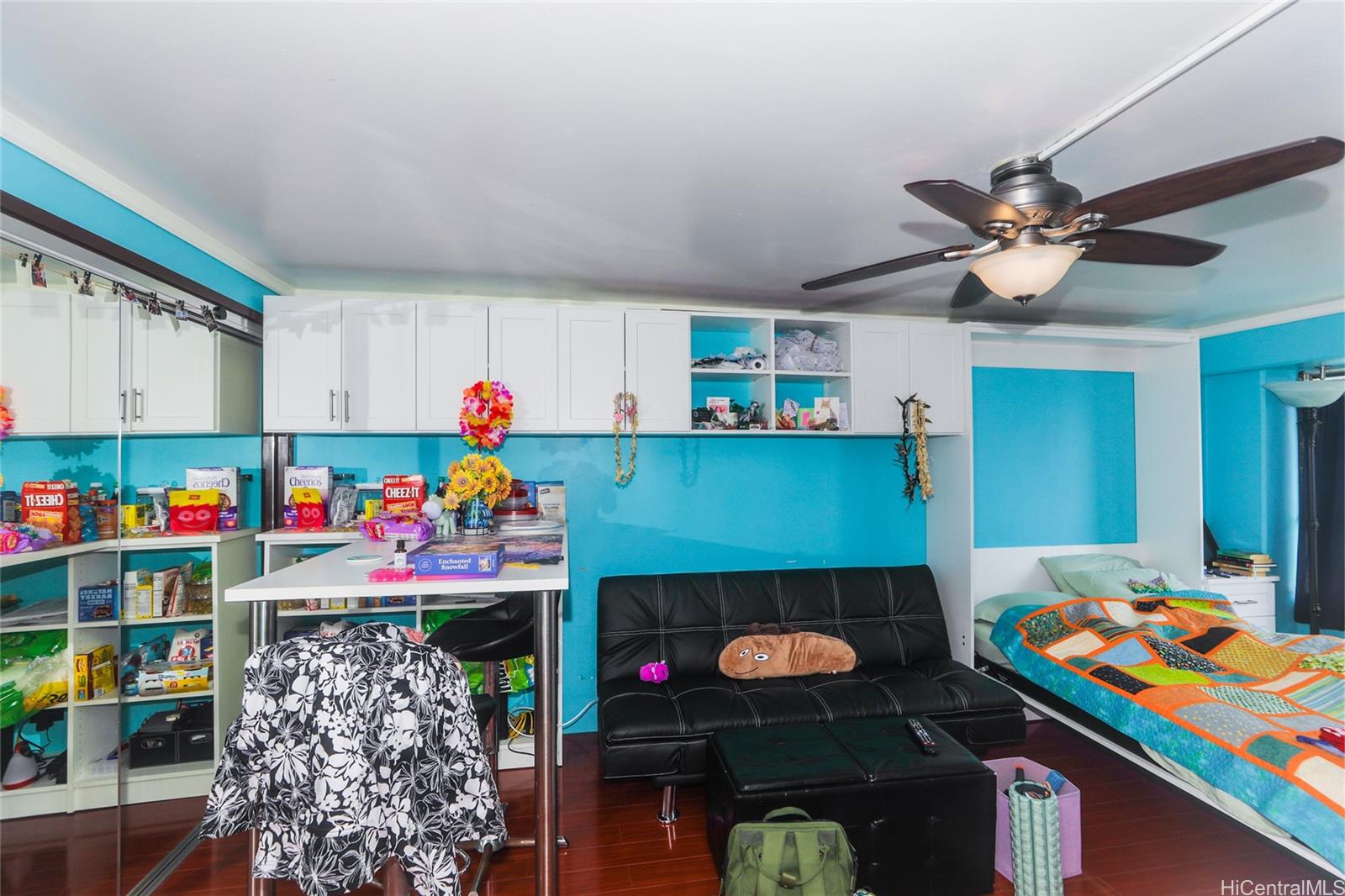 2525 Date Street, Unit 2303 Honolulu, HI 96826 - Photo 4 of 25 a play room with toys and a fireplace