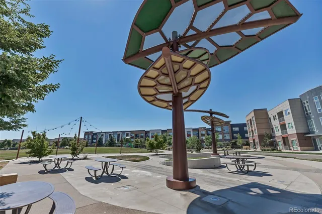 a view of a patio with a table and chairs