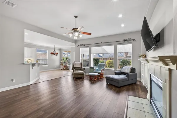 a living room with furniture fireplace and flat screen tv