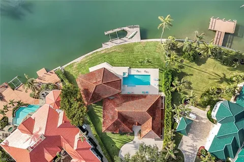 an aerial view of a house with outdoor space