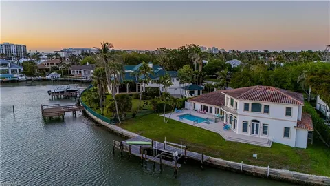 aerial view of a house with swimming pool and a yard