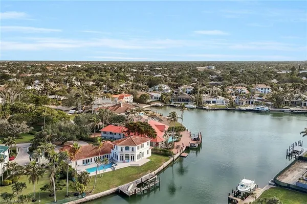 an aerial view of a city with ocean view