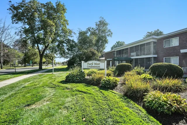 a front view of a house with garden and porch