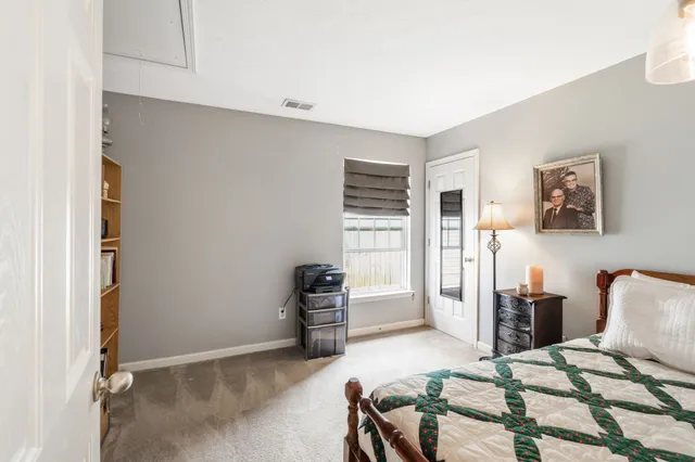 a bedroom with furniture and closet