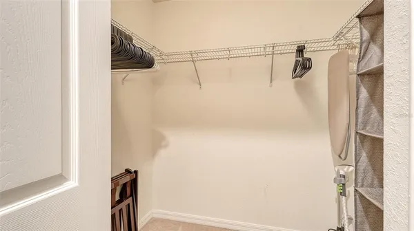 a bedroom with a bed and a night stand