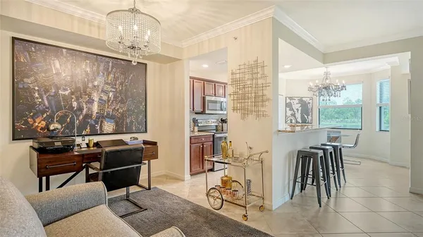 a kitchen with stainless steel appliances granite countertop a stove top oven a sink and a refrigerator