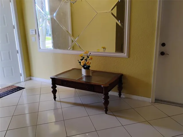 a room with a table and a mirror