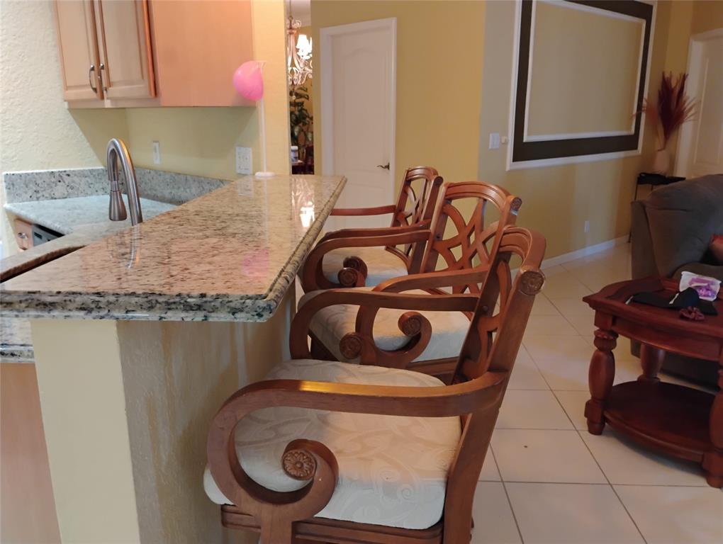 Undisclosed Address Royal Palm Beach, FL 33414 - Photo 14 of 32 a bathroom with a granite countertop sink and a mirror