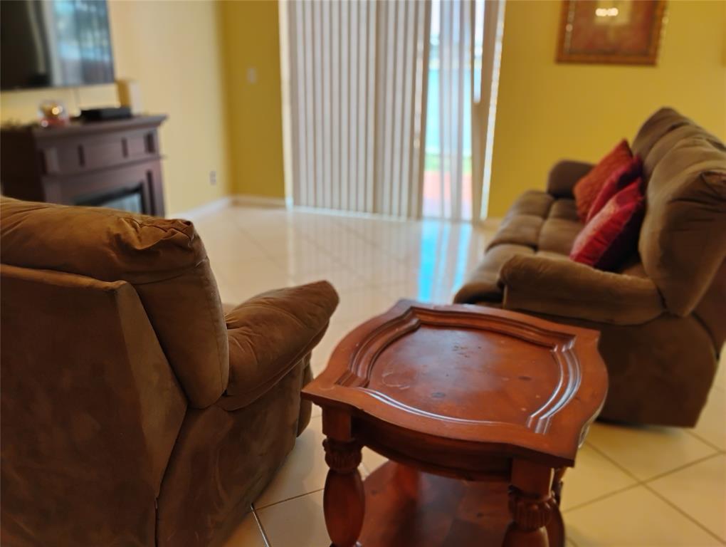 Undisclosed Address Royal Palm Beach, FL 33414 - Photo 18 of 32 a living room with furniture and a window