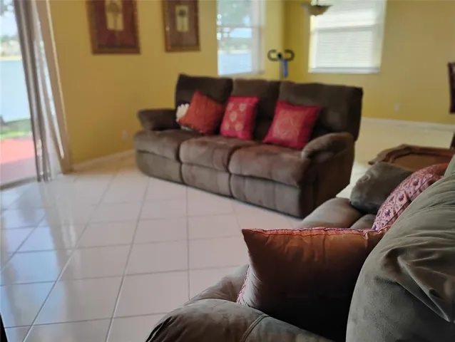 a living room with a couch and a window