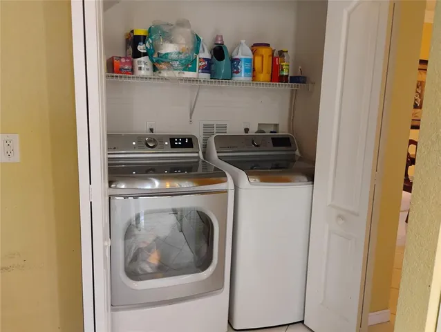 a utility room with dryer and washer