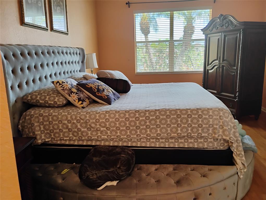 Undisclosed Address Royal Palm Beach, FL 33414 - Photo 21 of 32 a bed sitting in a bedroom next to a window