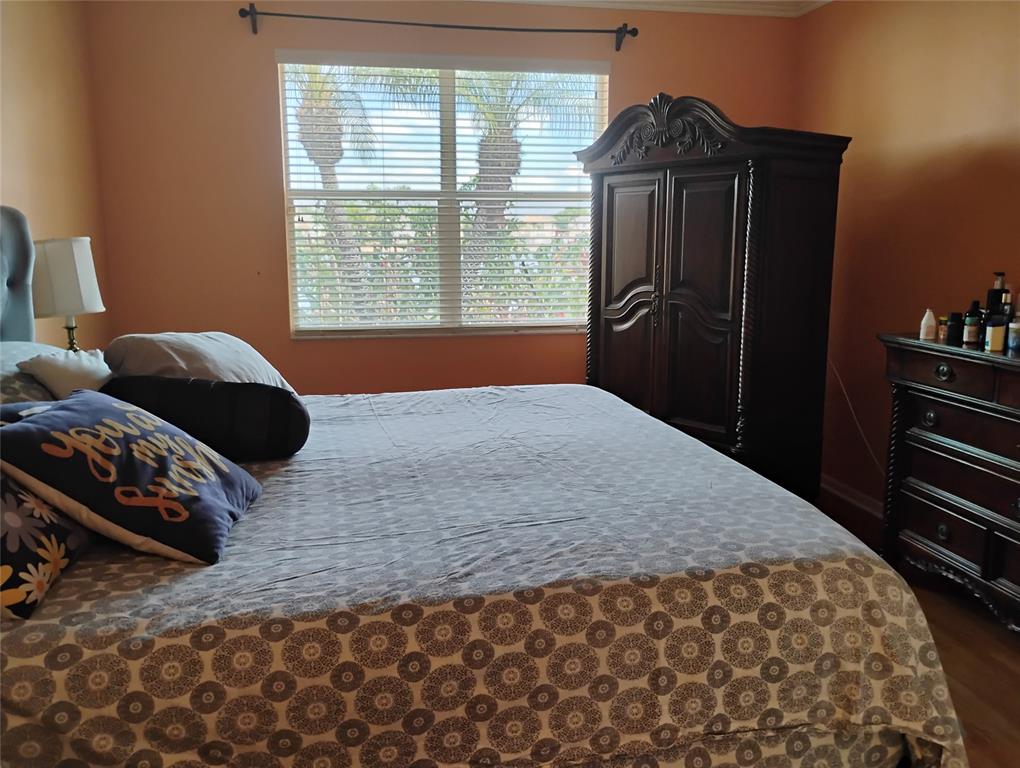 Undisclosed Address Royal Palm Beach, FL 33414 - Photo 25 of 32 a bedroom with a bed and a window