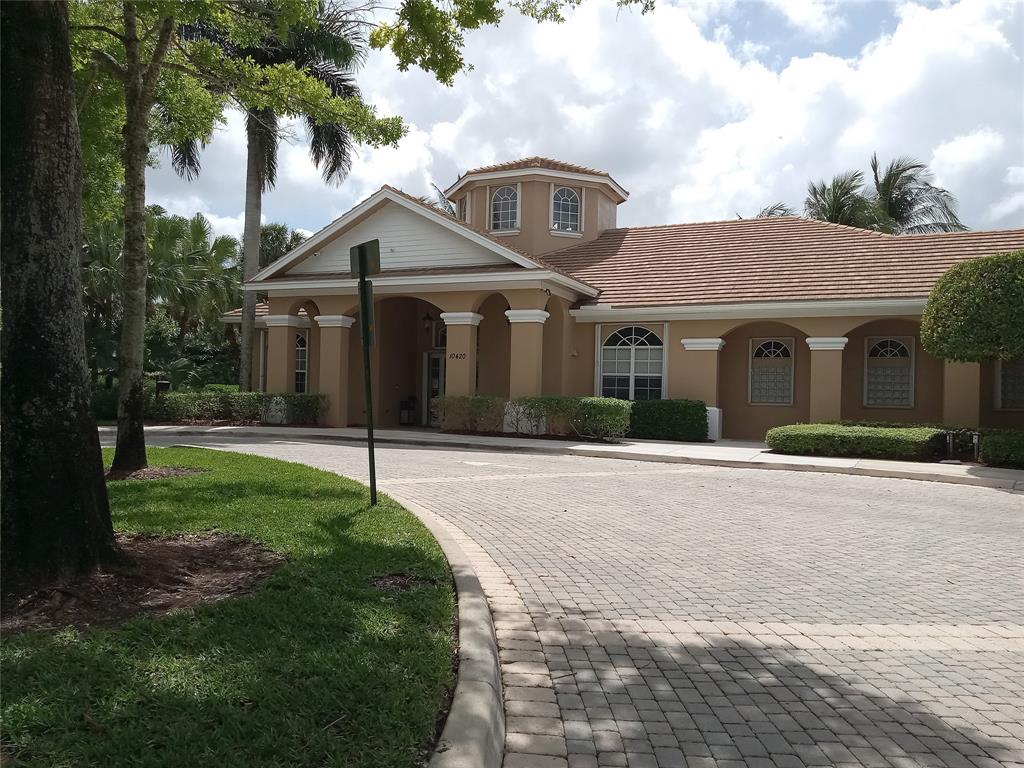Undisclosed Address Royal Palm Beach, FL 33414 - Photo 28 of 32 a front view of a house with a yard and garage