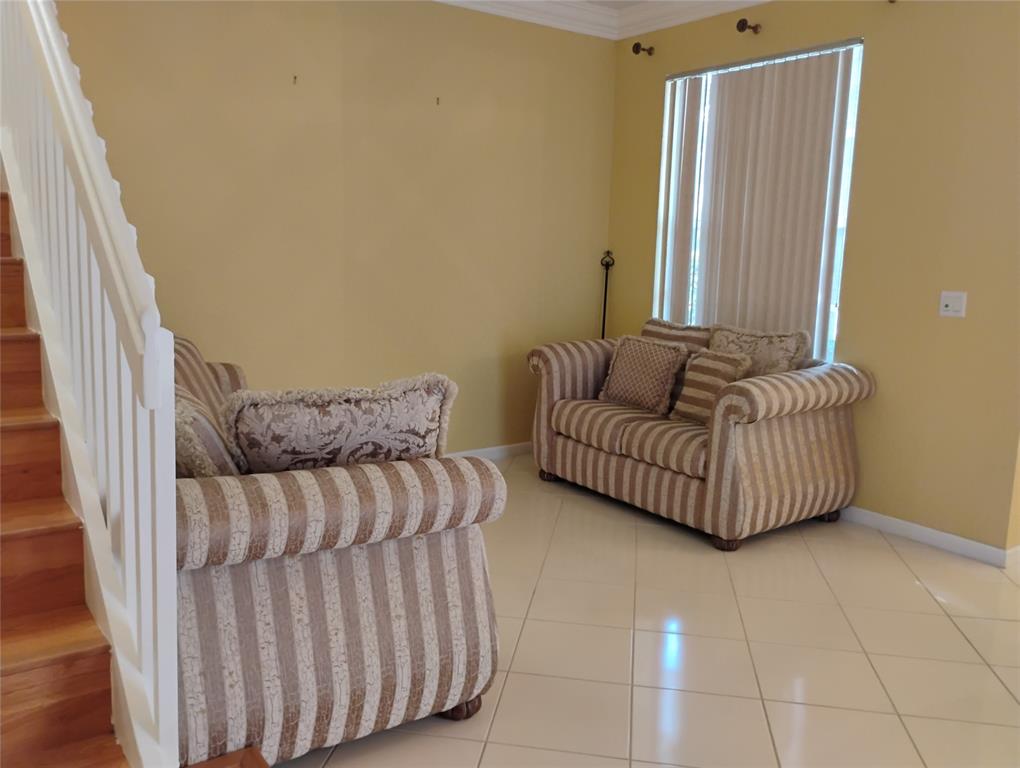 Undisclosed Address Royal Palm Beach, FL 33414 - Photo 3 of 32 a living room with furniture and a window