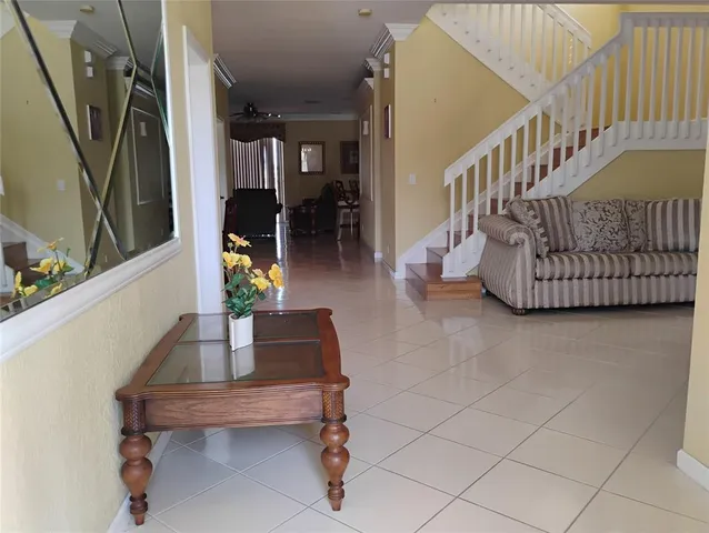 a living room with furniture and a rug