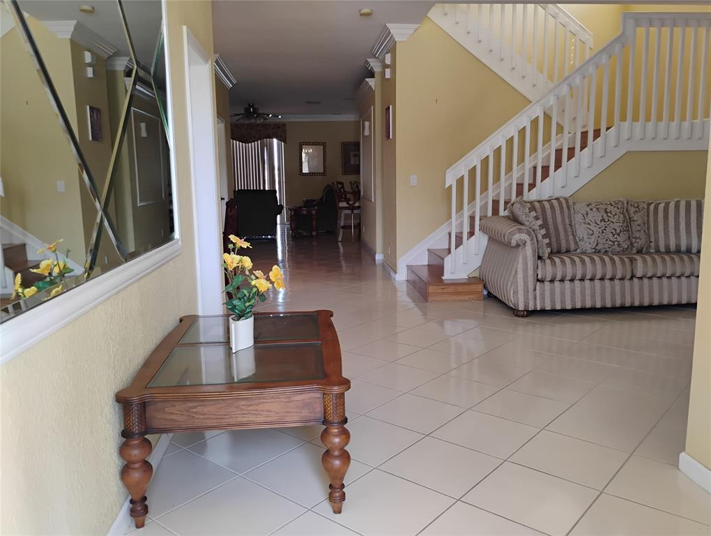 Undisclosed Address Royal Palm Beach, FL 33414 - Photo 10 of 32 a living room with furniture and a rug