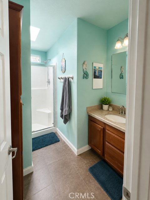 28820 Memory Winchester, CA 92596 - Photo 7 of 18 a bathroom with a sink and a mirror