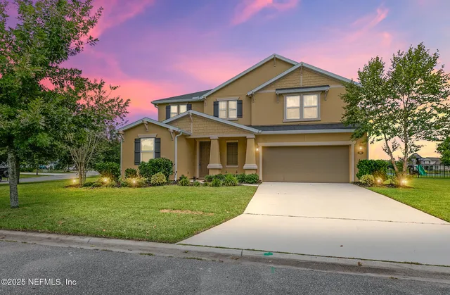 a front view of a house with a yard