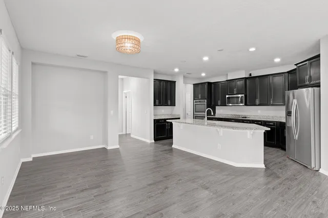 a view of a hallway with windows