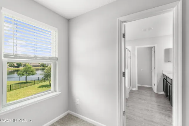 a view of room with window and ceiling fan