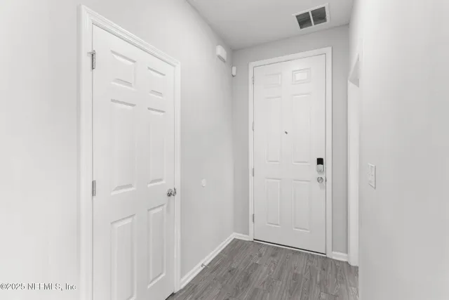 a bathroom with a shower sink vanity mirror and toilet