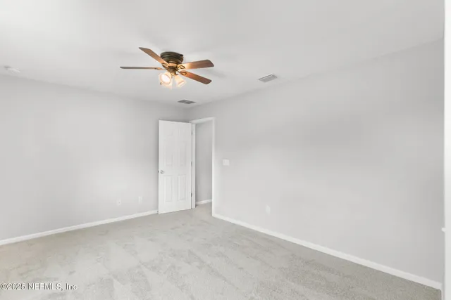 a view of a swimming pool with a deck and a yard