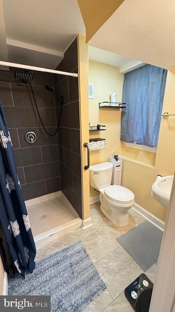 7907 Subet Road Windsor Mill, MD 21244 - Photo 22 of 31 a bathroom with a sink toilet and shower