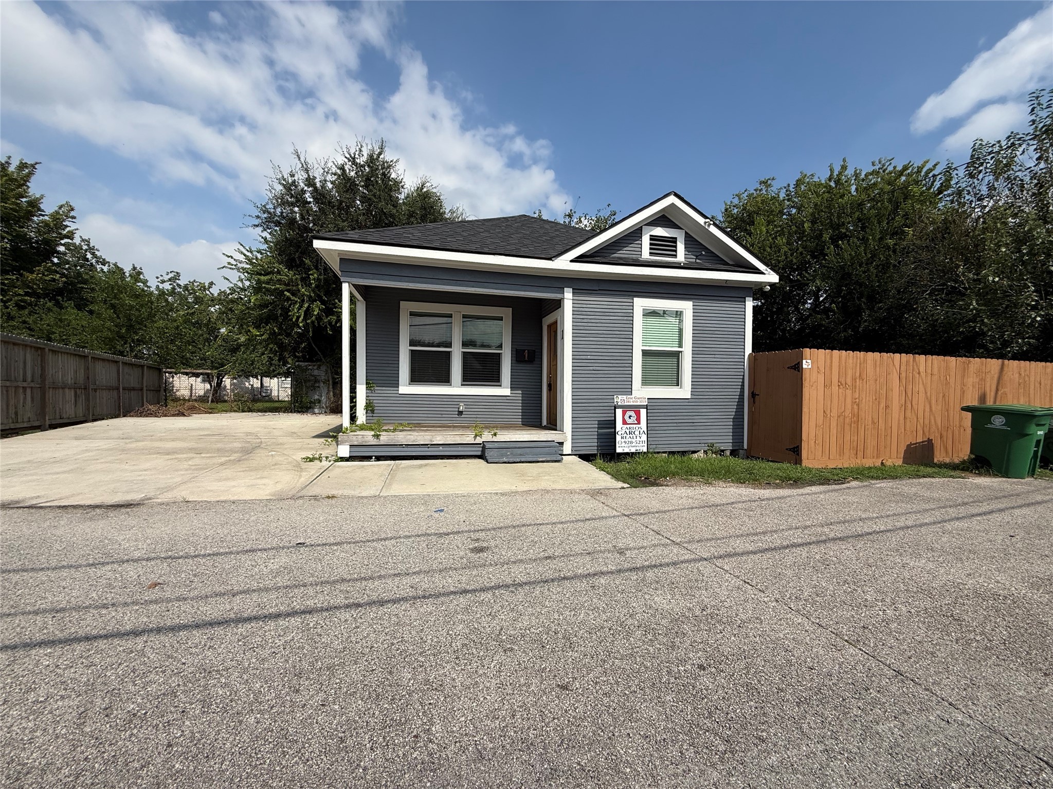 1 Canal Court Houston, TX 77011 - Photo 1 of 18 a front view of a house with a yard and garage