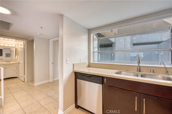 a kitchen with a sink and a refrigerator