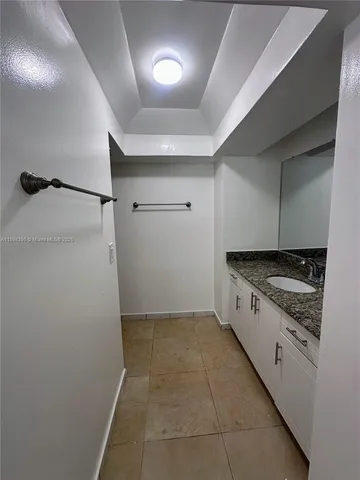 a kitchen with a stove and a refrigerator