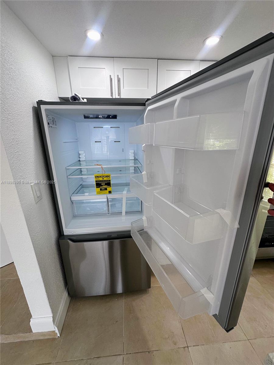 9064 Collins Avenue, Unit C19 Surfside, FL 33154 - Photo 4 of 17 a bathroom with a bathtub and a shower