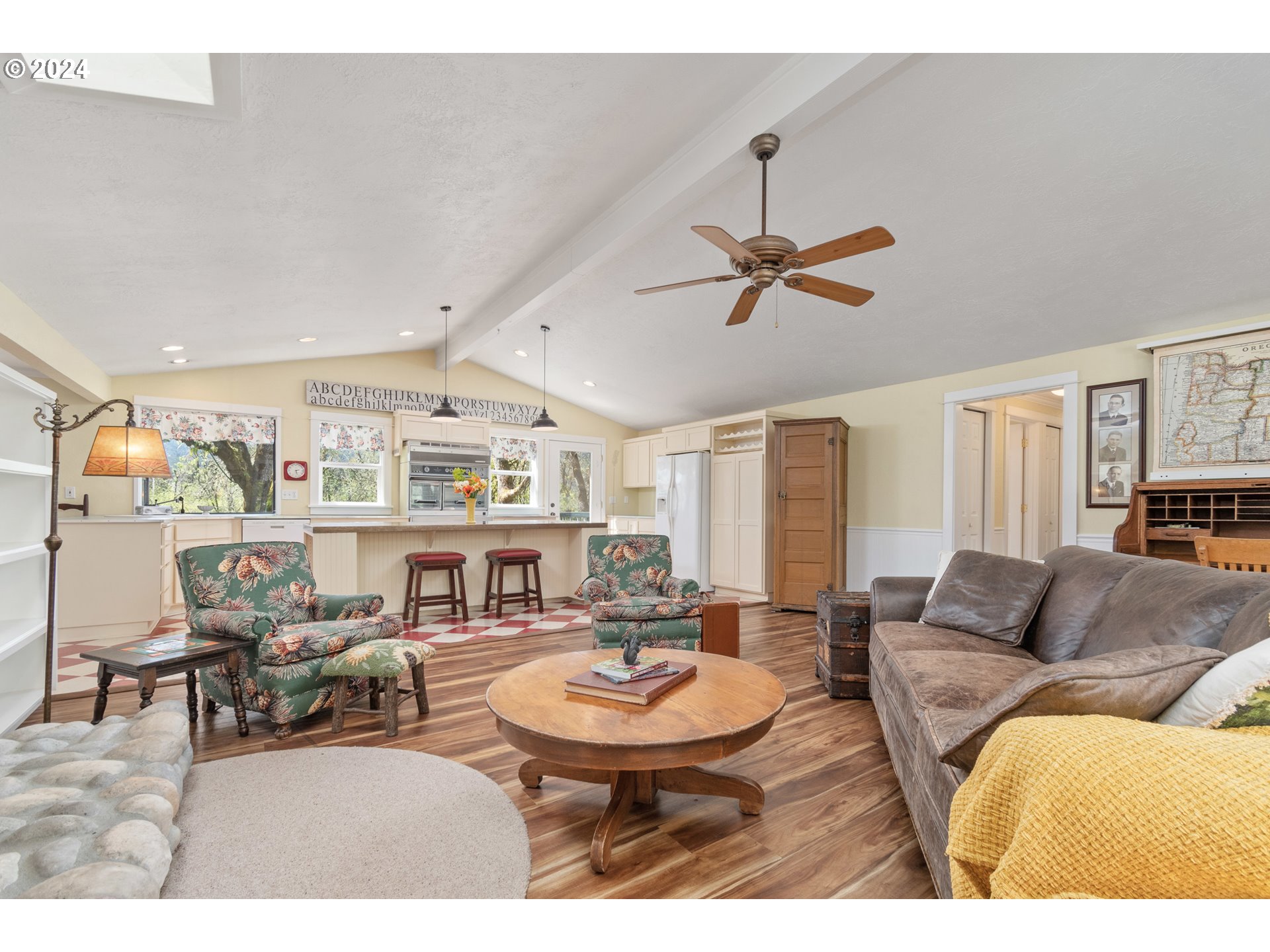 90482 Sunderman Road Springfield, OR 97478 - Photo 14 of 40 a living room with furniture a fireplace and a chandelier