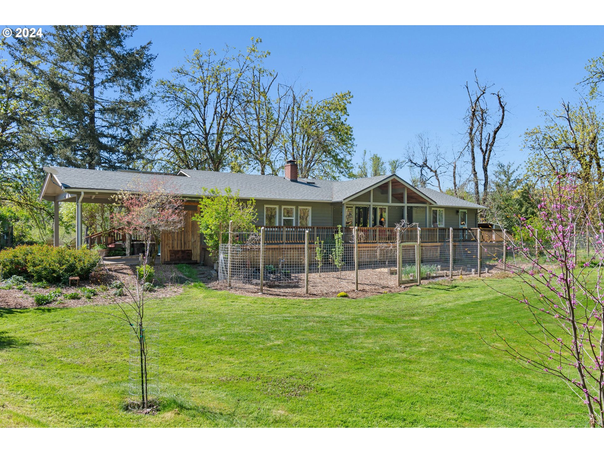 90482 Sunderman Road Springfield, OR 97478 - Photo 2 of 40 a view of a house with a yard and sitting area