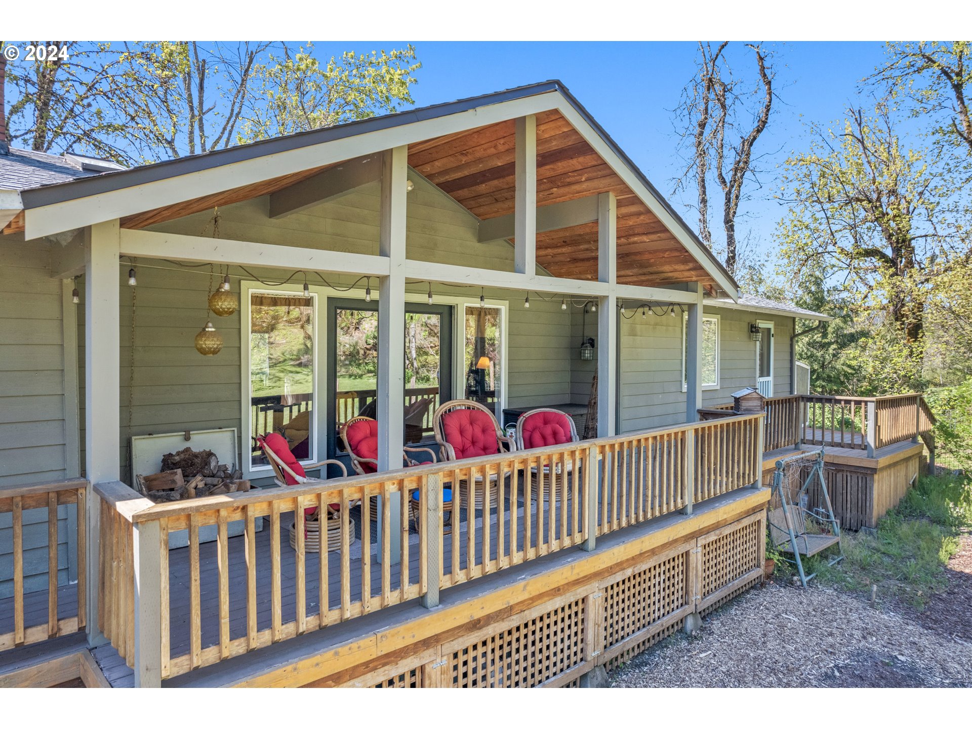 90482 Sunderman Road Springfield, OR 97478 - Photo 3 of 40 a view of a wooden house with a porch