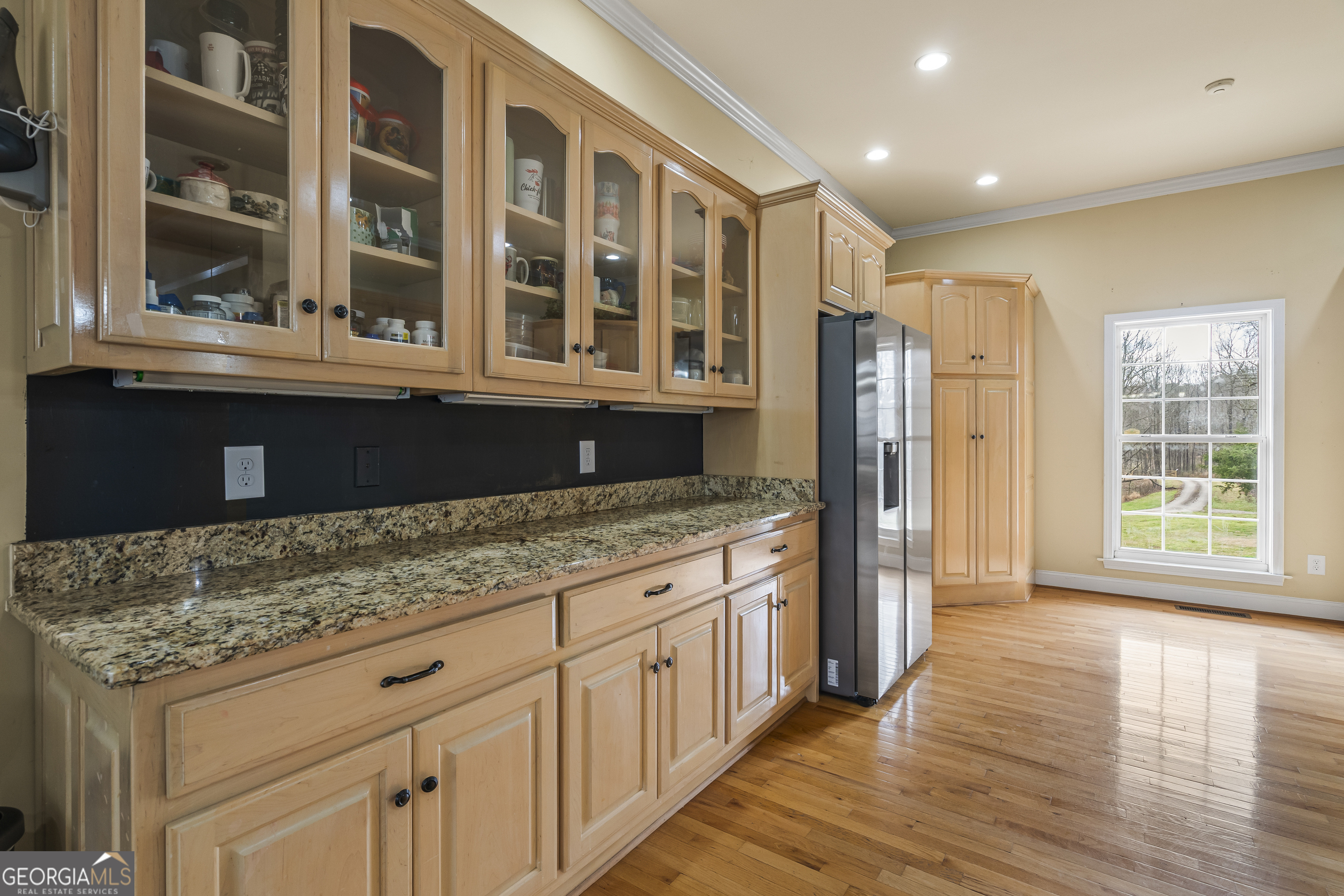 568 Hunt Road Carnesville, GA 30521 - Photo 23 of 106 a kitchen with stainless steel appliances granite countertop a refrigerator oven a sink with wooden cabinets and glass door