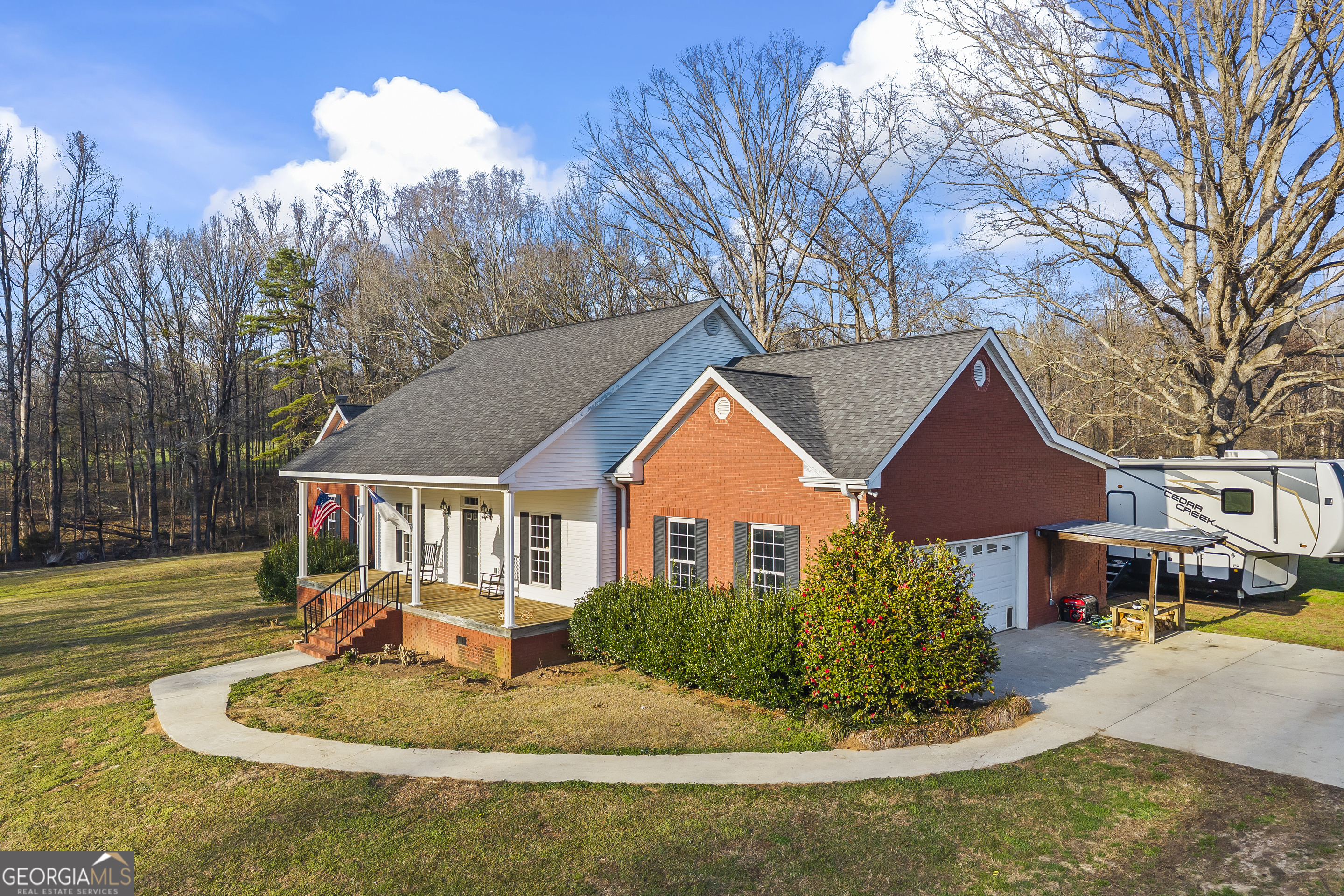 568 Hunt Road Carnesville, GA 30521 - Photo 3 of 106 a front view of a house with entertaining space