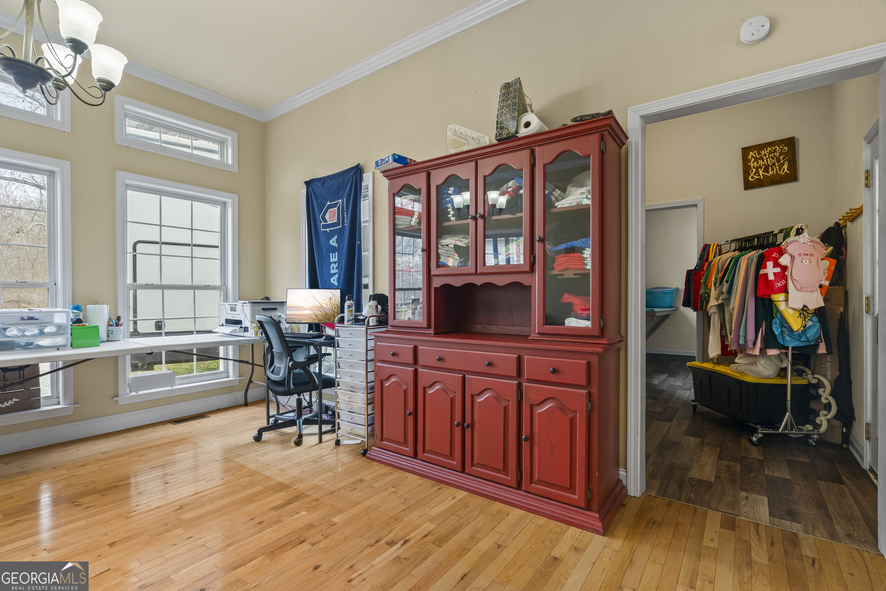 568 Hunt Road Carnesville, GA 30521 - Photo 32 of 106 a view of a dining room with furniture a chandelier and wooden floor