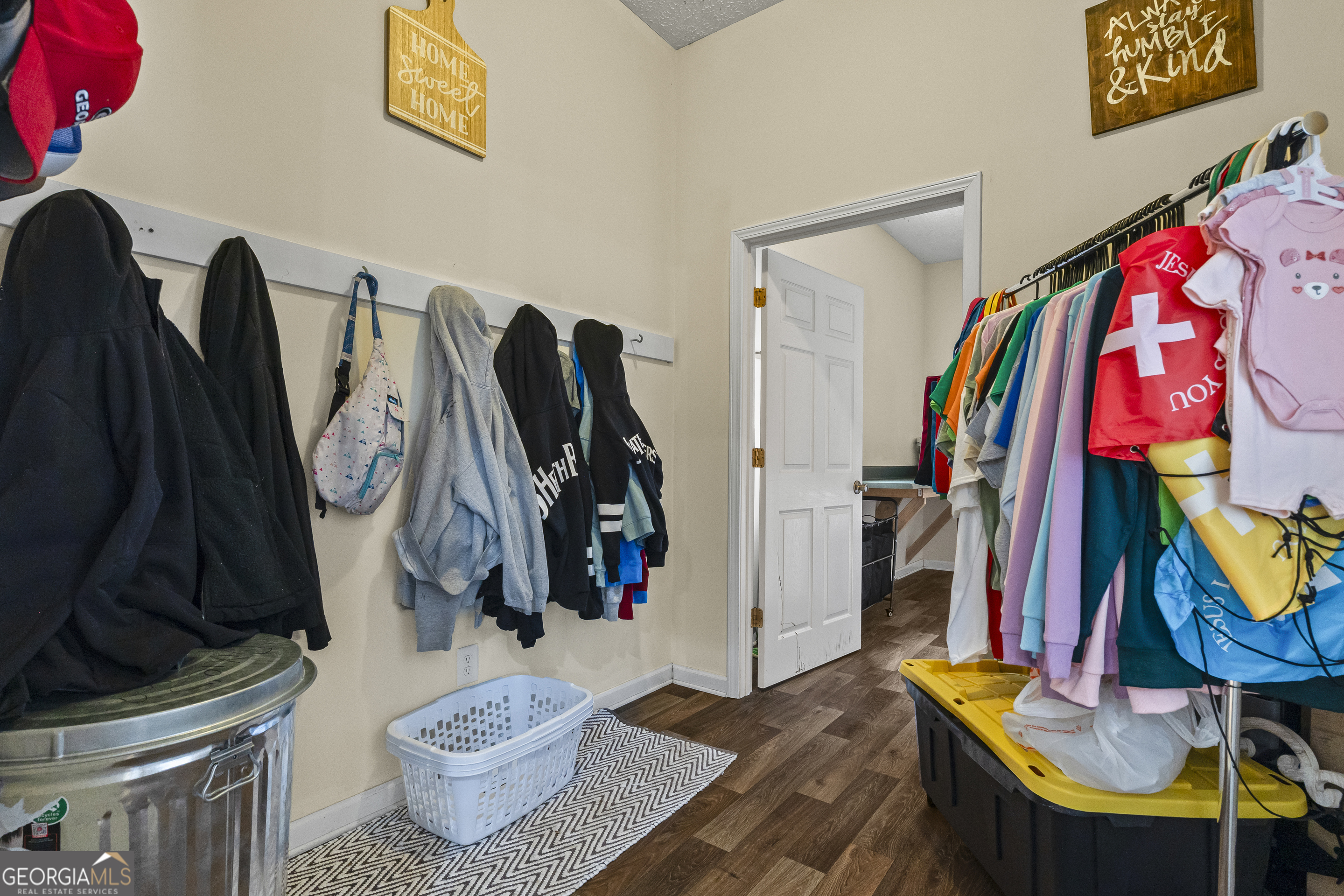 568 Hunt Road Carnesville, GA 30521 - Photo 35 of 106 a view of walk in closet with clothes and shoes