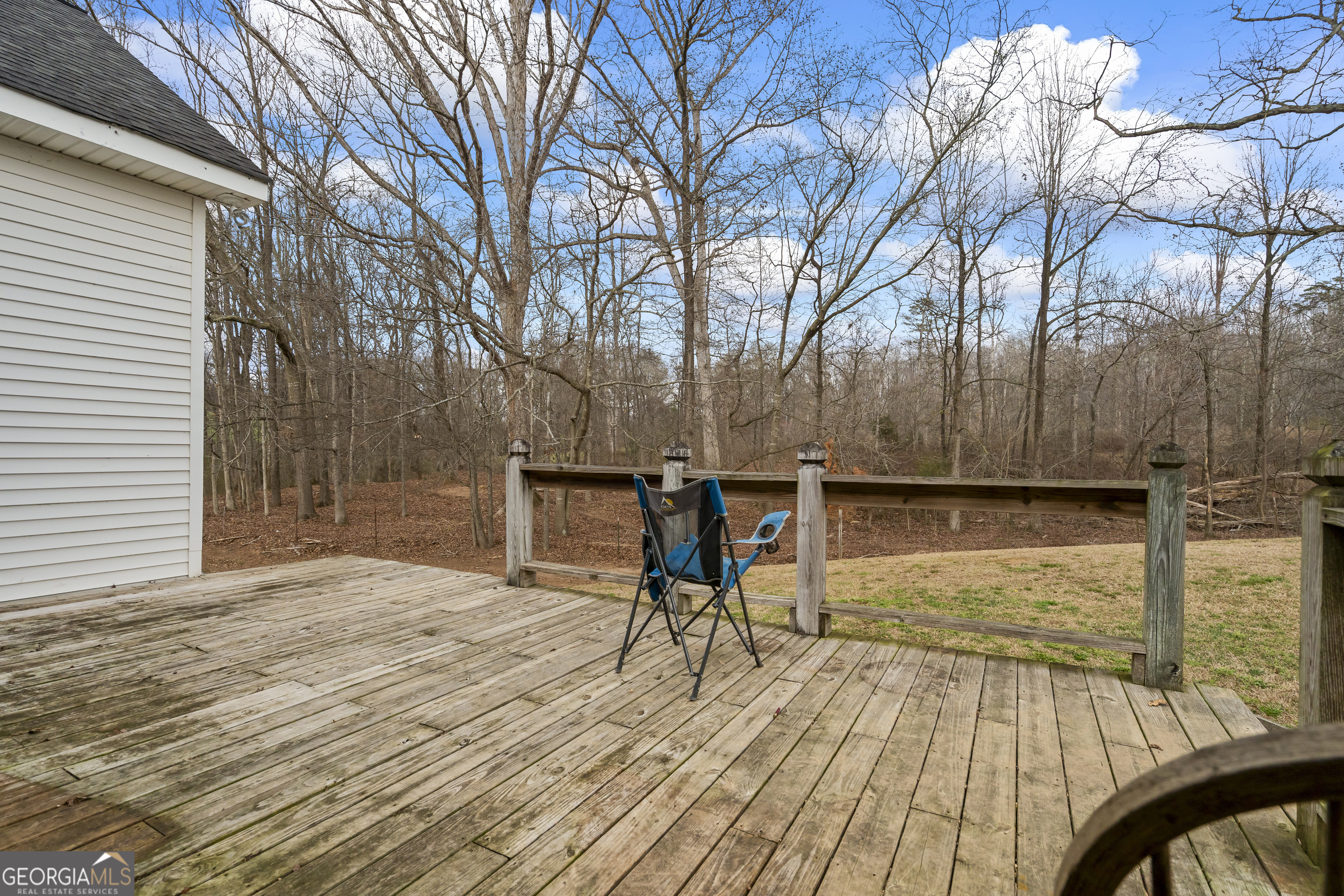 568 Hunt Road Carnesville, GA 30521 - Photo 40 of 106 a roof deck with table and chairs and wooden floor