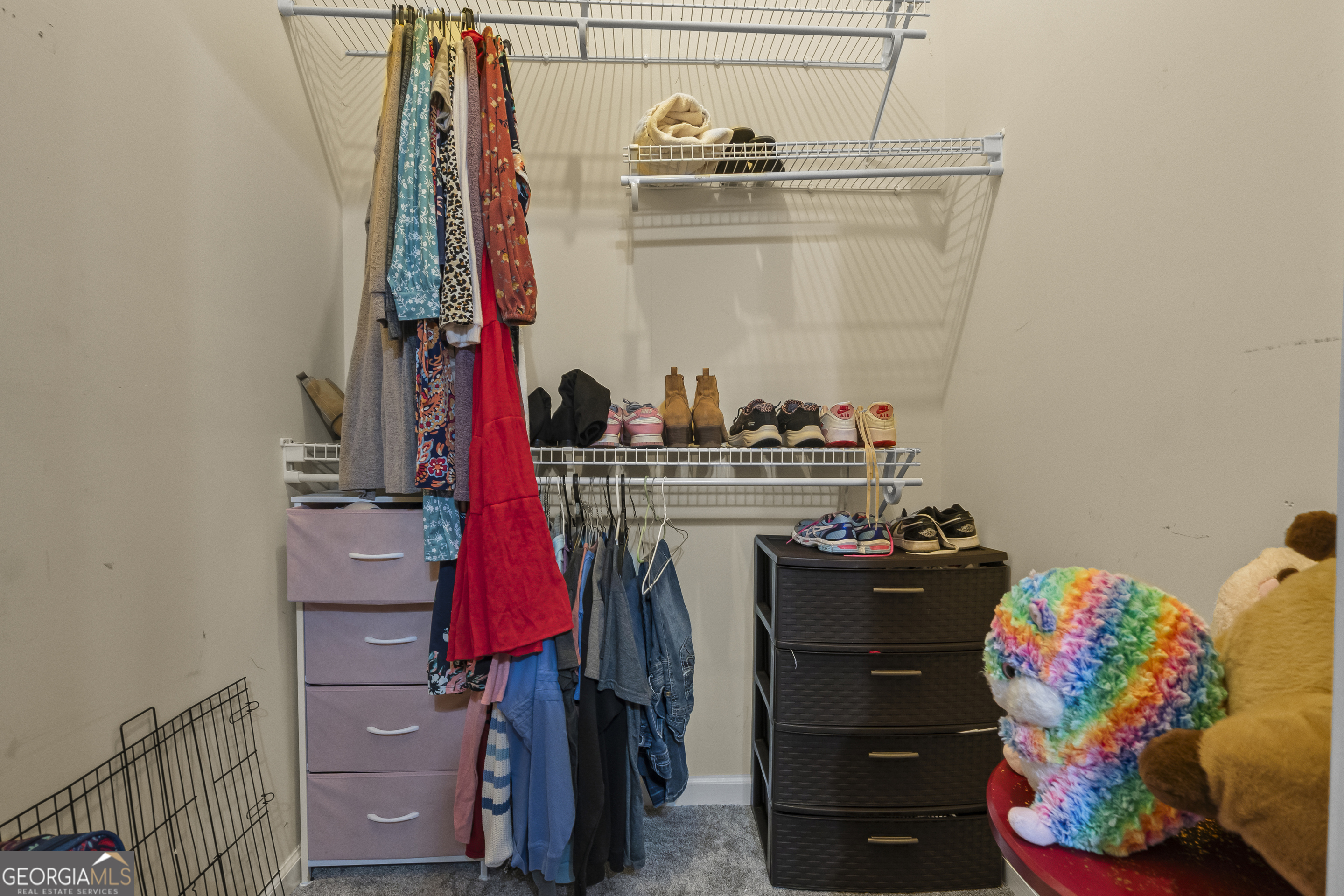 568 Hunt Road Carnesville, GA 30521 - Photo 44 of 106 a view of walk in closet with clothes and shoes