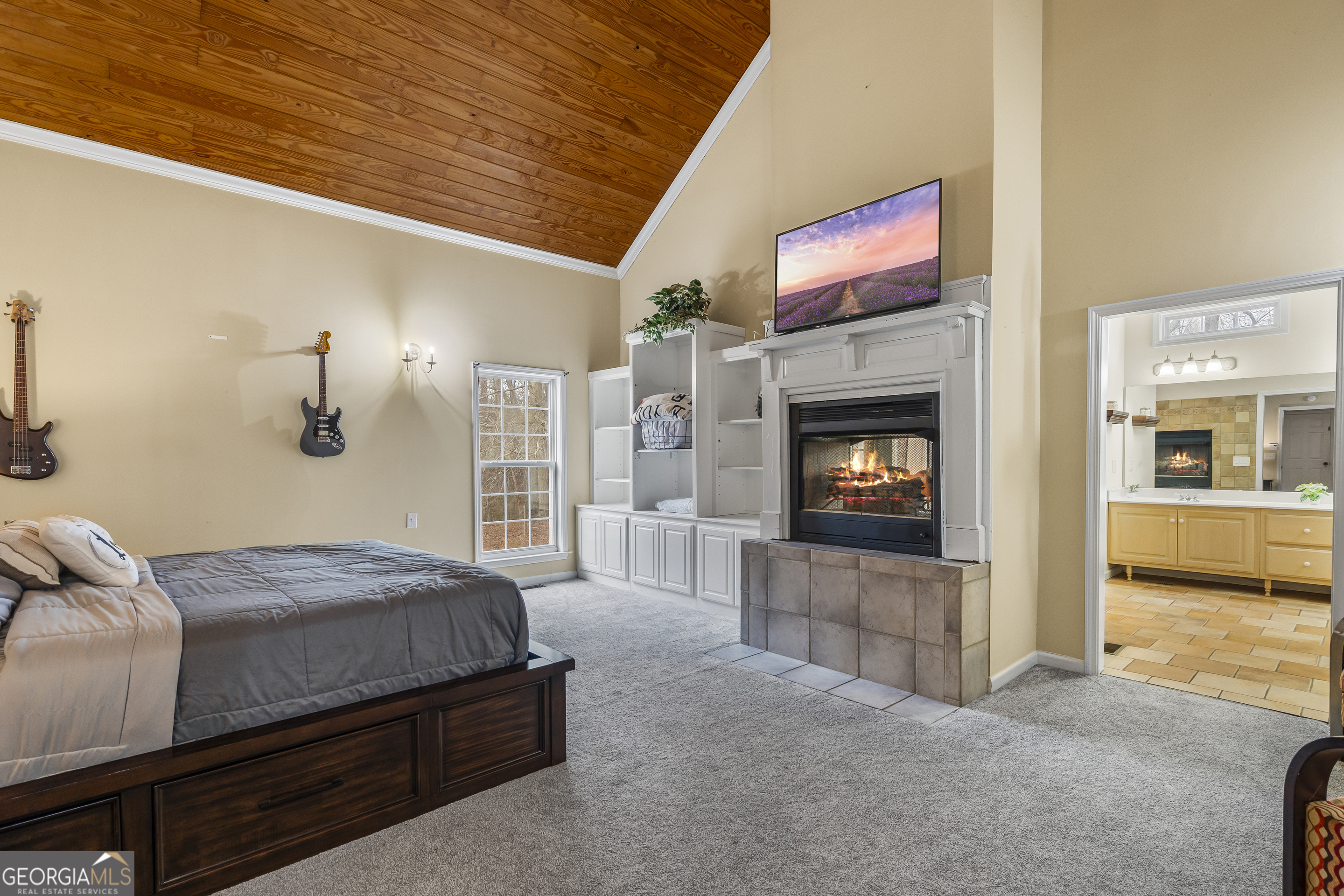 568 Hunt Road Carnesville, GA 30521 - Photo 48 of 106 a bedroom with a bed and a fireplace